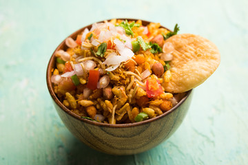 Bhelpuri Chaat/chat is a road side tasty food from India, served in a bowl or plate. selective focus
