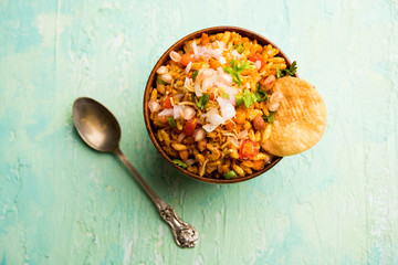 Bhelpuri Chaat/chat is a road side tasty food from India, served in a bowl or plate. selective focus