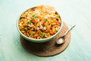 Bhelpuri Chaat/chat is a road side tasty food from India, served in a bowl or plate. selective focus