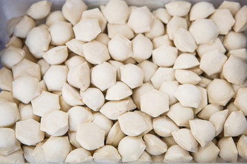 The process of making dumplings, dumplings close-up. The rolling test, the unfolding of beef, dumpling making gloved hands.