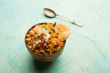 Bhelpuri Chaat/chat is a road side tasty food from India, served in a bowl or plate. selective focus