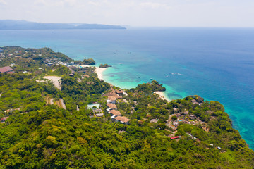 Fototapeta na wymiar Boracay island, view from above. Rocky coast with rainforest. Seascape with green island.