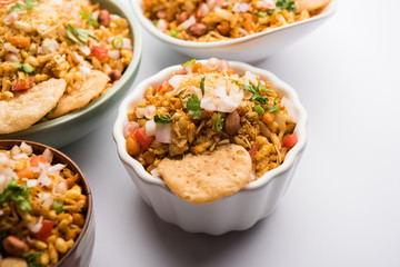 Bhelpuri Chaat/chat is a road side tasty food from India, served in a bowl or plate. selective focus