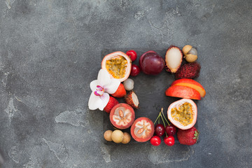   Small exotic fruit plate top view with place for text