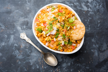 Bhelpuri Chaat/chat is a road side tasty food from India, served in a bowl or plate. selective focus