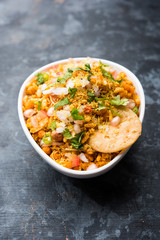 Bhelpuri Chaat/chat is a road side tasty food from India, served in a bowl or plate. selective focus