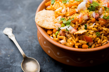 Bhelpuri Chaat/chat is a road side tasty food from India, served in a bowl or plate. selective focus