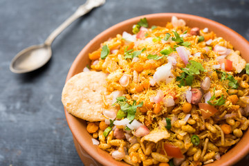 Bhelpuri Chaat/chat is a road side tasty food from India, served in a bowl or plate. selective focus