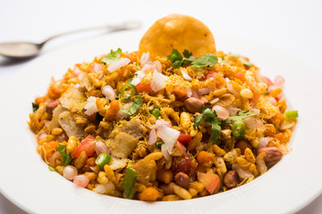 Bhelpuri Chaat/chat is a road side tasty food from India, served in a bowl or plate. selective focus