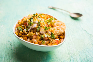 Bhelpuri Chaat/chat is a road side tasty food from India, served in a bowl or plate. selective focus