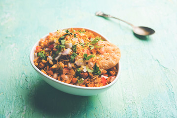 Bhelpuri Chaat/chat is a road side tasty food from India, served in a bowl or plate. selective focus