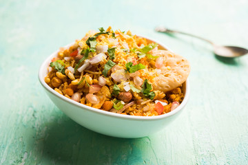 Bhelpuri Chaat/chat is a road side tasty food from India, served in a bowl or plate. selective focus