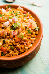 Bhelpuri Chaat/chat is a road side tasty food from India, served in a bowl or plate. selective focus