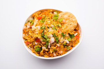 Bhelpuri Chaat/chat is a road side tasty food from India, served in a bowl or plate. selective focus