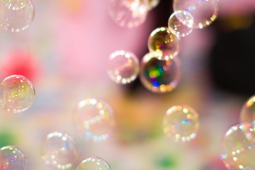 soap bubbles on pink background 