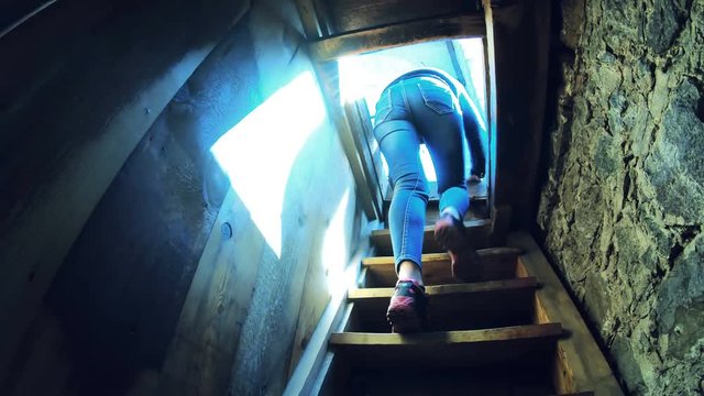 Tourists descend the stairs of church tower after seeing the panoramic view of Bansko Bulgaria