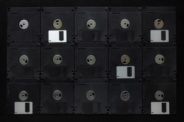 retro floppy from old computer on black background. 