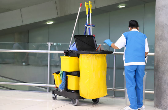 Closeup of woman cleaning worker doing her work with cleaning equipment and tools at the airport. 
