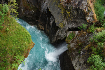 Journey to Norway, top view of the blue river flowing between steep rocky shores