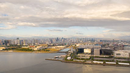 Manila city in the morning, view from above. Panorama of a large port city. City with modern buildings and skyscrapers. Manila, the capital of the Philippines. Asian metropolis.