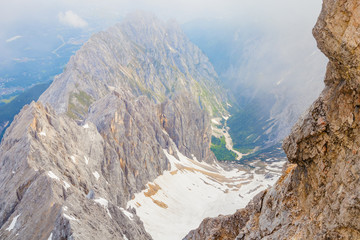 Panoramic view of the European Alps from the top of Zugspitze on a sunny summer day