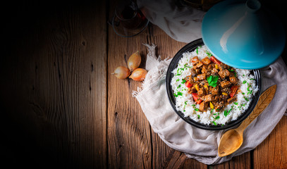 Tajin beef stew with rice paprika and sesame seeds