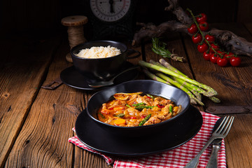 colorful turkey fricassee with asparagus and paprika