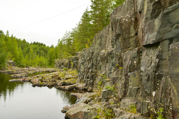 Fototapeta na wymiar Gray stone reflected in water