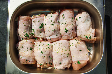 Meat products: cutlets, stuffed cabbage, meatballs in bacon. Fresh appetizing meat store products in metal trays