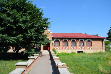 View of the building from the red brick in the forest Park.