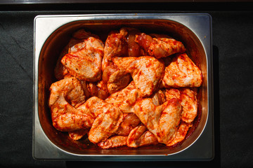 Meat products: cutlets, stuffed cabbage, meatballs in bacon. Fresh appetizing meat store products in metal trays