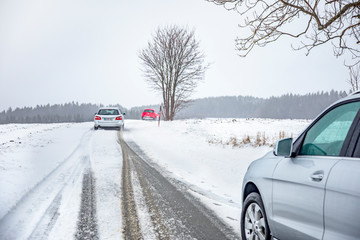 Obraz na płótnie Canvas Car traffic on snowy road