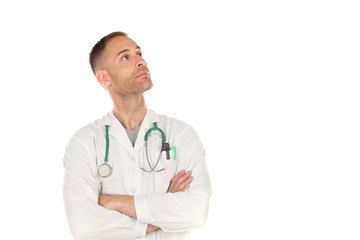 Pensive young doctor wearing a white gown