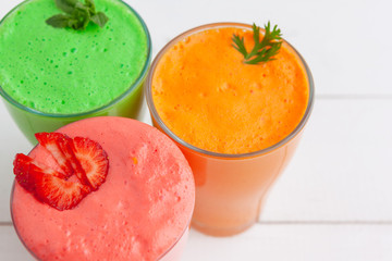 Row of healthy fresh fruit and vegetable smoothies