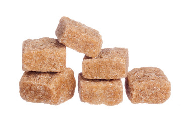Brown cane sugar cubes isolated on white background