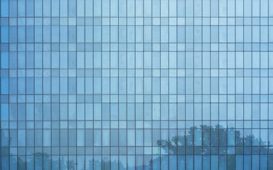 Fototapeta na wymiar Glass windows of high rise commercial skyscraper building , for business concept background .