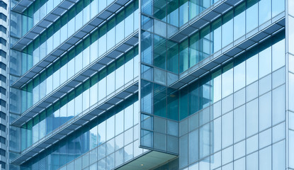 Fototapeta na wymiar Glass windows of corporate business Office building , for business concept background .