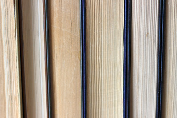 Stack of paper retro books close up, vintage background.
