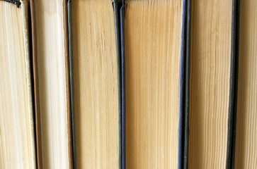Stack of paper retro books close-up, vintage background, education concept.