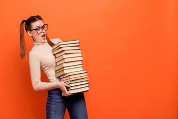 Close up side profile photo beautiful funny she her lady yelling oh no open mouth hold arms hands many books prepare examination wear casual pastel pullover clothes isolated orange background