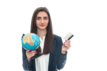 Fototapeta premium Woman with globe and credit card isolated on white