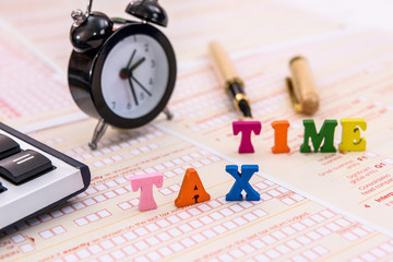 Clock and 'tax time' text on australian tax form