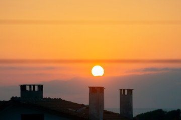 Sunrise over the roof. View from Sinemorets resort, Southern Black Sea Coast, Bulgaria.