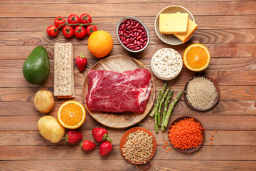Fototapeta na wymiar Different healthy food on wooden table