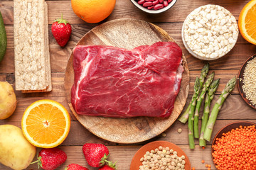 Different healthy food on wooden table