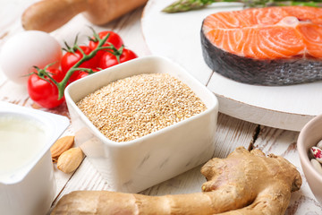 Different healthy food on white wooden table