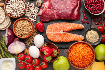 Different healthy food on grey background