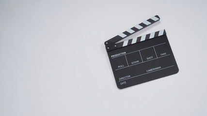 Fototapeta na wymiar Clapperboard or movie slate use in video production, film and cinema industry. It's black color on white paper background.