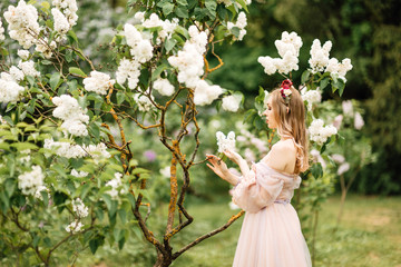 beautiful slender girl with dark hair in gentle elegant dress, fairy-tale princess in the spring...