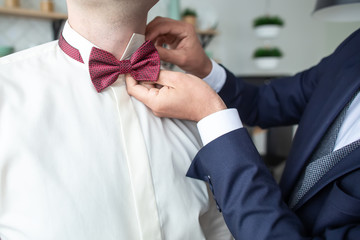 Preparations for the wedding. Fees of the groom. Groom in a jacket. The morning of the groom